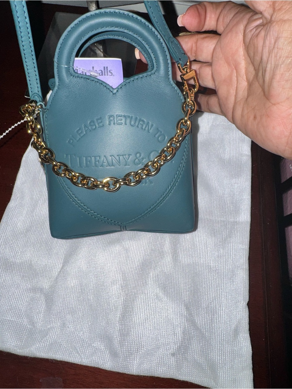Tiffany & Co. teal leather mini bag with gold chain